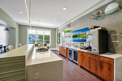 A kitchen with a counter and a microwave.