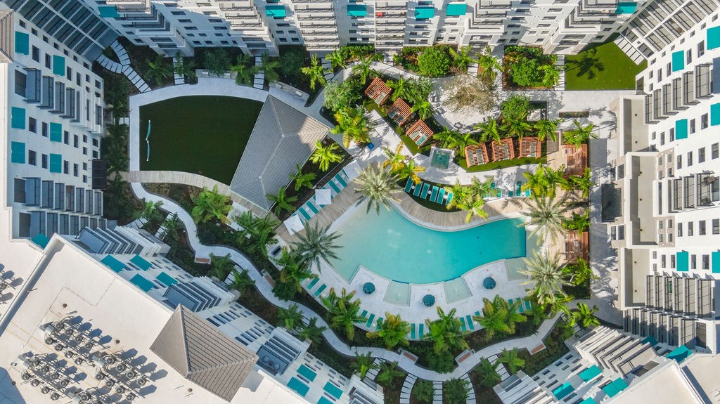 a rendering of a hotel with a swimming pool and a courtyard