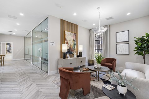 A modern living room with a brown chair and a white couch.