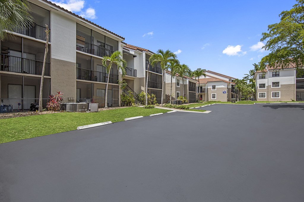 a view of a building at the whispering winds apartments in pearland, tx
