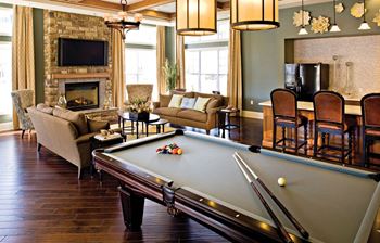 Fireplace and pool table at Cascades at Tinton Falls, Tinton Falls, NJ