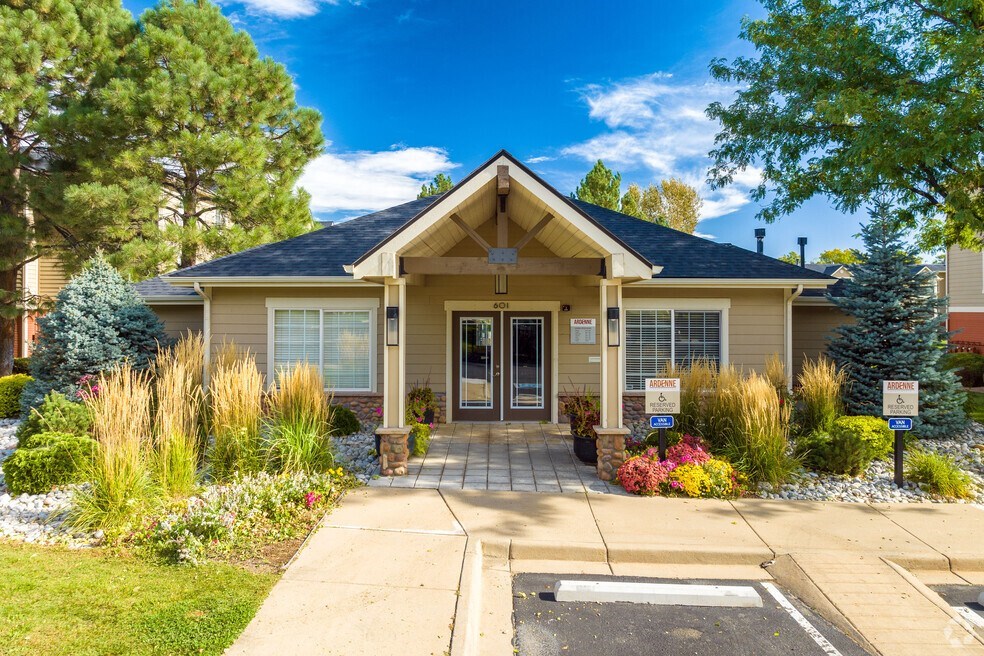 the front of a house with a driveway and a porch