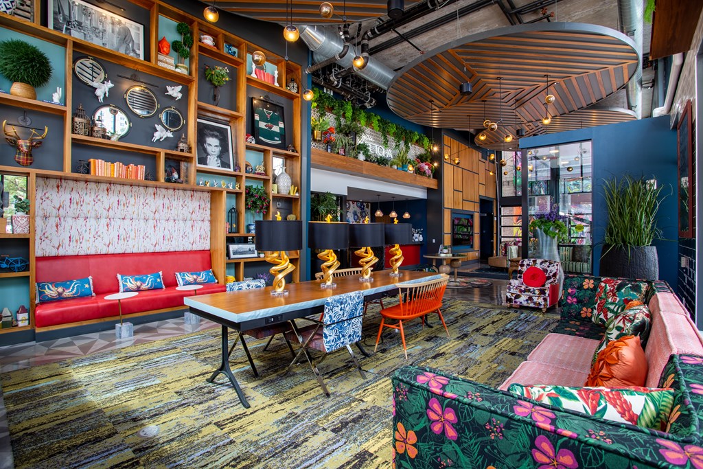 a living room with furniture and a large table