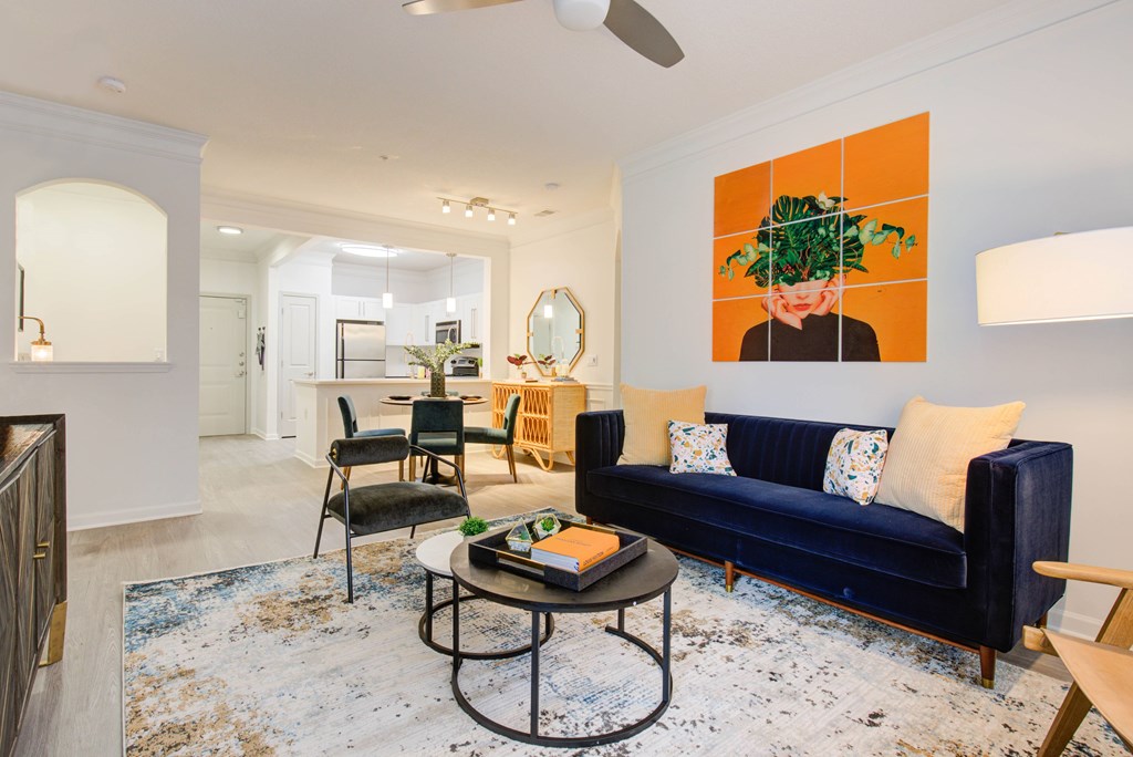 a living room with a blue couch and a coffee table