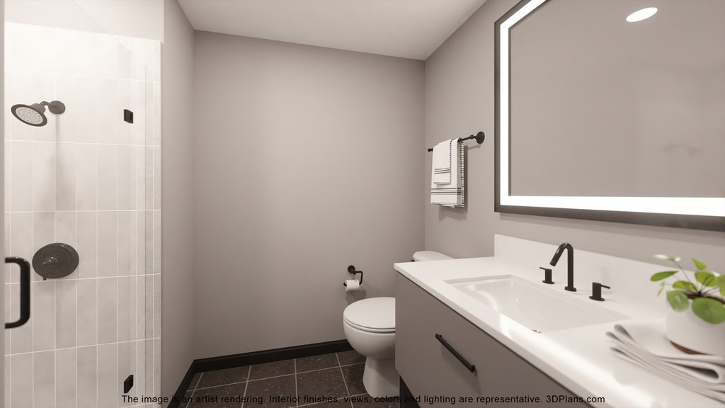 a bathroom with a large mirror and a toilet and a sink