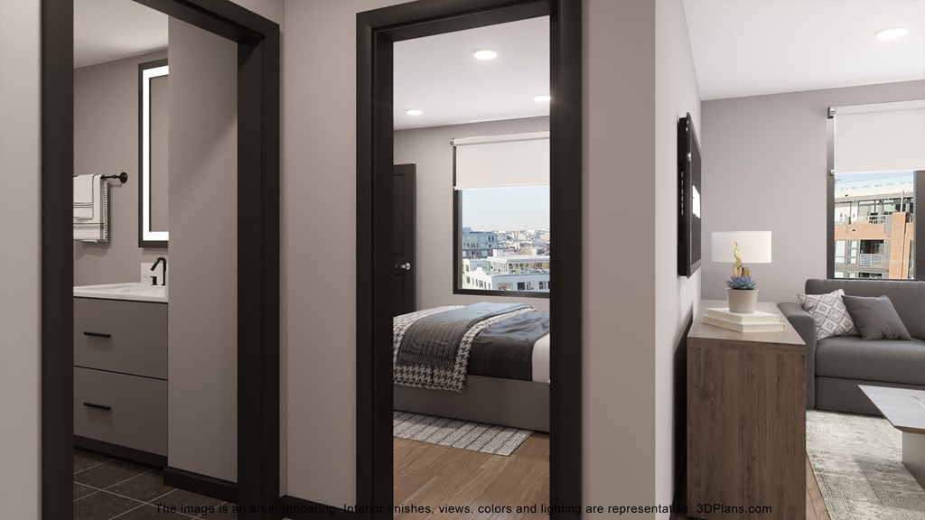 a view of a bedroom and a living room with a window