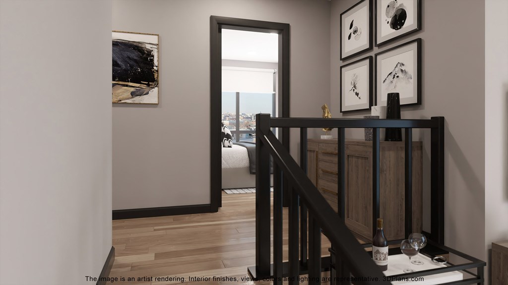 a view from the top of a staircase of a room with a door to a