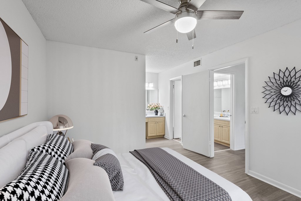Master bedroom with plank flooring