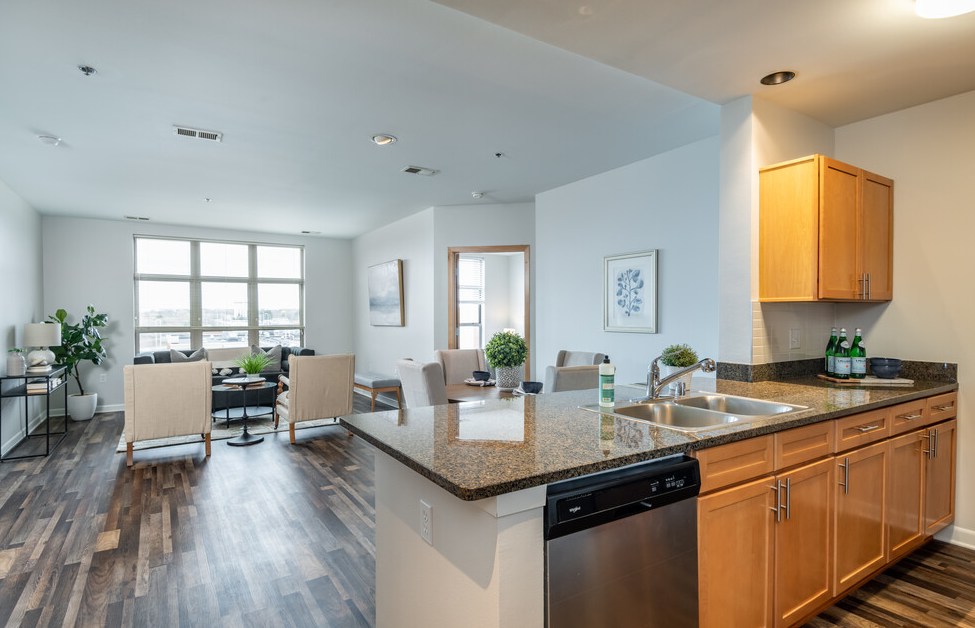 a kitchen and living room in a 555 waverly unit