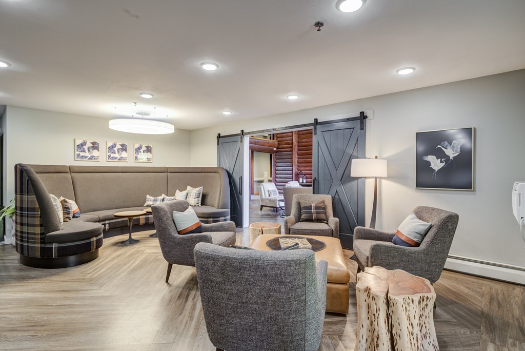 a living room with couches chairs and a table