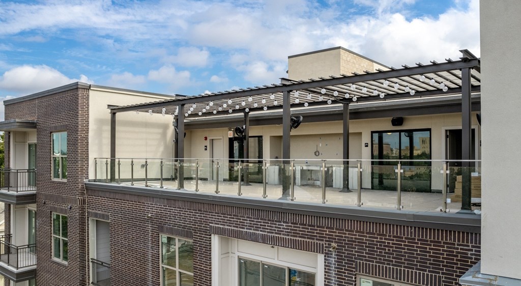 the upper deck of a building with a roof terrace