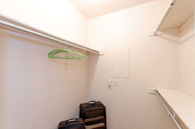 Spacious Walk In Closet with Three Hanging Rods