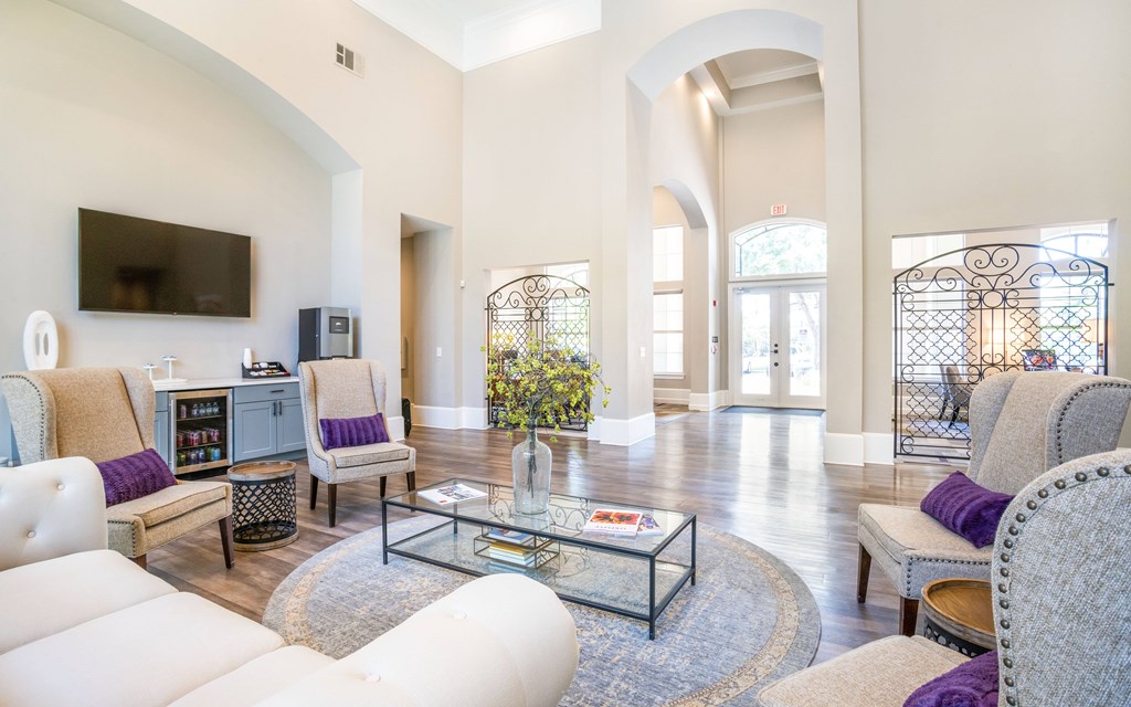 a living room filled with furniture and a flat screen tv