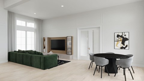 A modern living room with a green sofa and a black table.