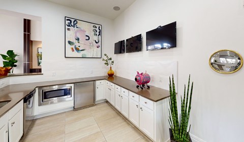 a kitchen with a counter top and a sink