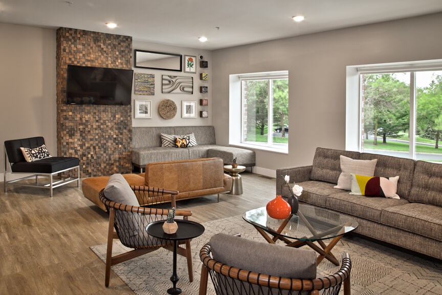 a living room with couches and chairs