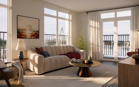 A living room with a large window overlooking a balcony.