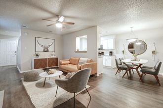 Rock Springs living room with view of eating area and kitchen pass through.