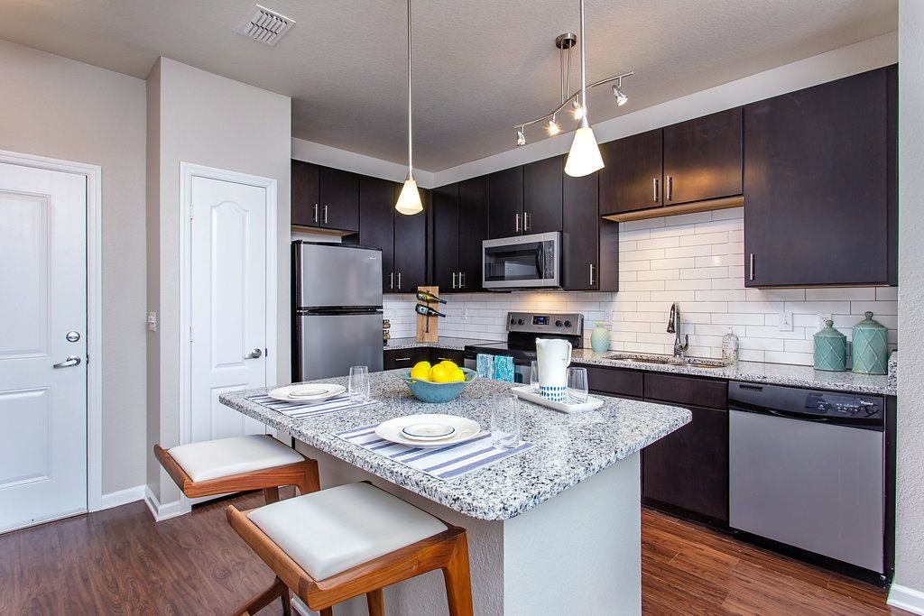 a kitchen with a granite counter top
