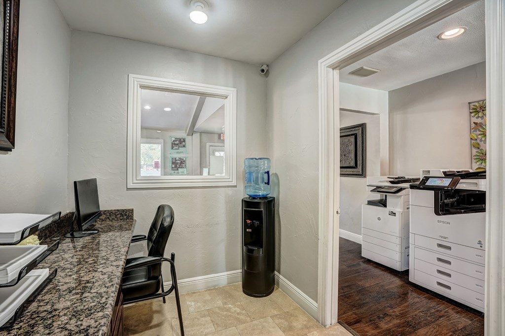 a kitchen with a counter top and a refrigerator