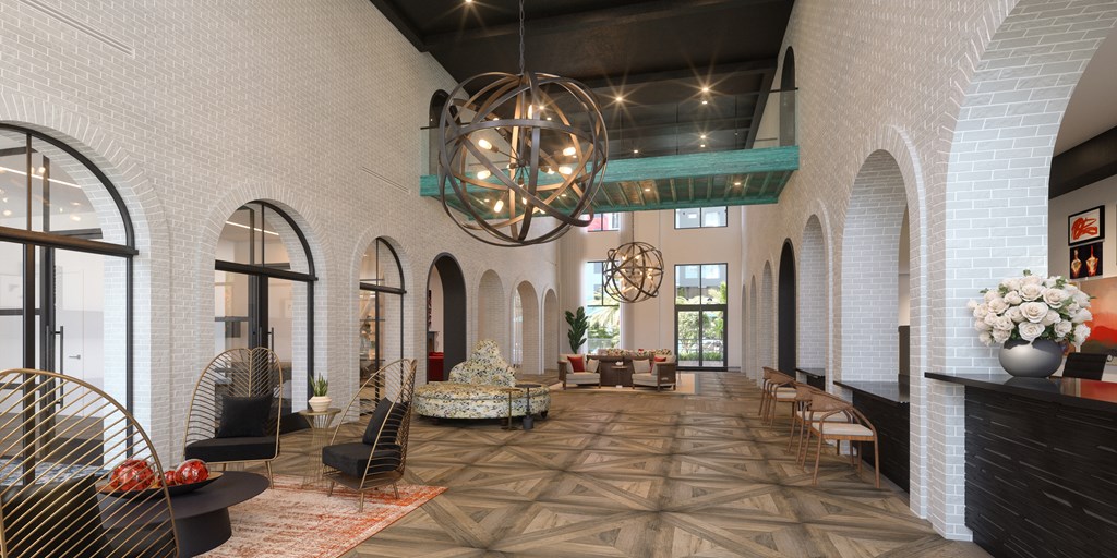a large lobby with arched windows and a large chandelier