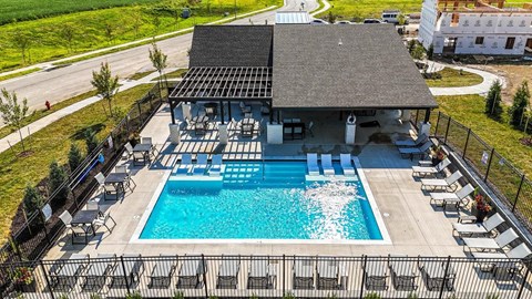 Oak Grove, MO Pet-Friendly Apartments - Rustic Heights - Image, Pool deck with grilling station and lounge chairs.