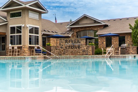 a swimming pool at the riverstone resort and spa