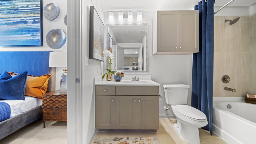 a bathroom with a sink toilet and a bath tub