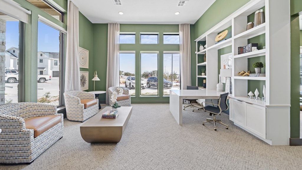 a living room with green walls and a window