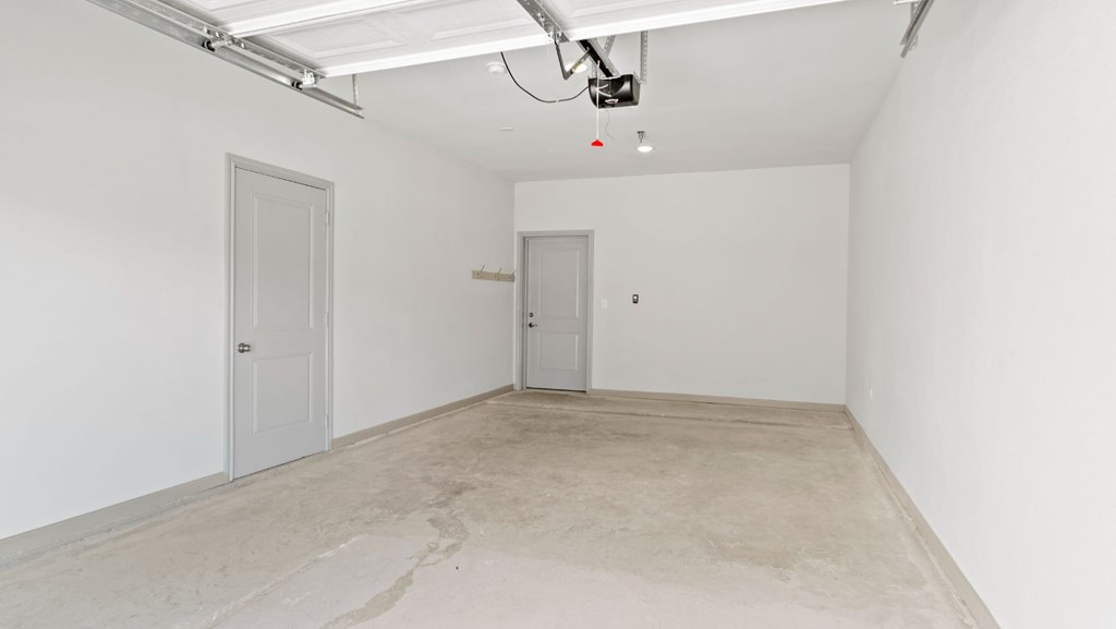 a empty room with a door in the end of it