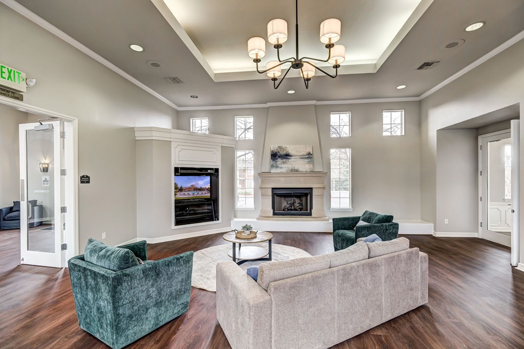 Sonoma Clubhouse with large windows, plank flooring, living room furniture and built in flat screen tv