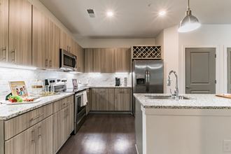 View of Kitchen. Tons of Counter Space, Pantry and Free Standing Island with Sink View of Kitchen. Tons of Counter Space, Pantry and Free Standing Island with Sink - Photo Gallery