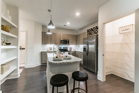 a kitchen with stainless steel appliances and granite counter tops