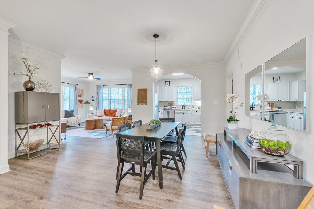 a kitchen and dining room with a table and chairs