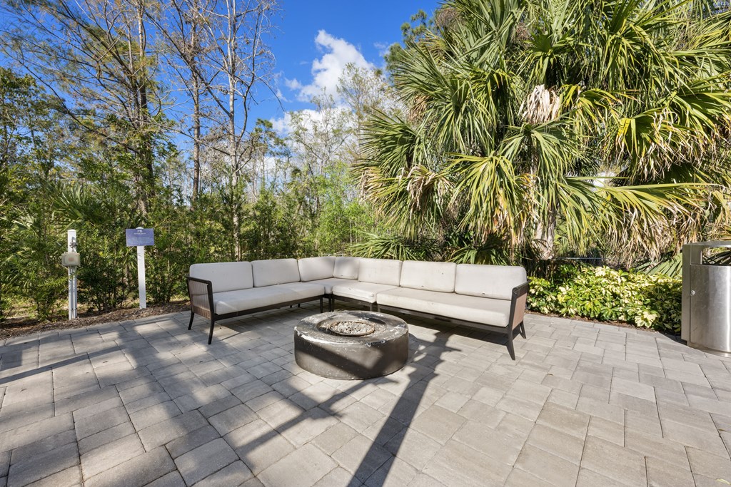 a patio with a couch and a coffee table on it