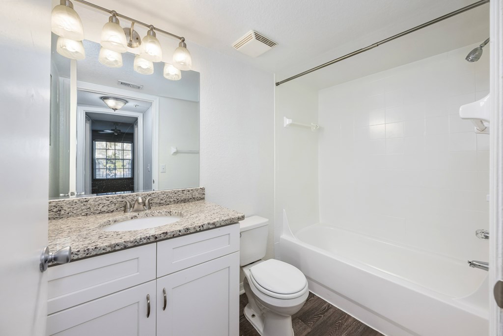 a bathroom with a sink toilet and a shower