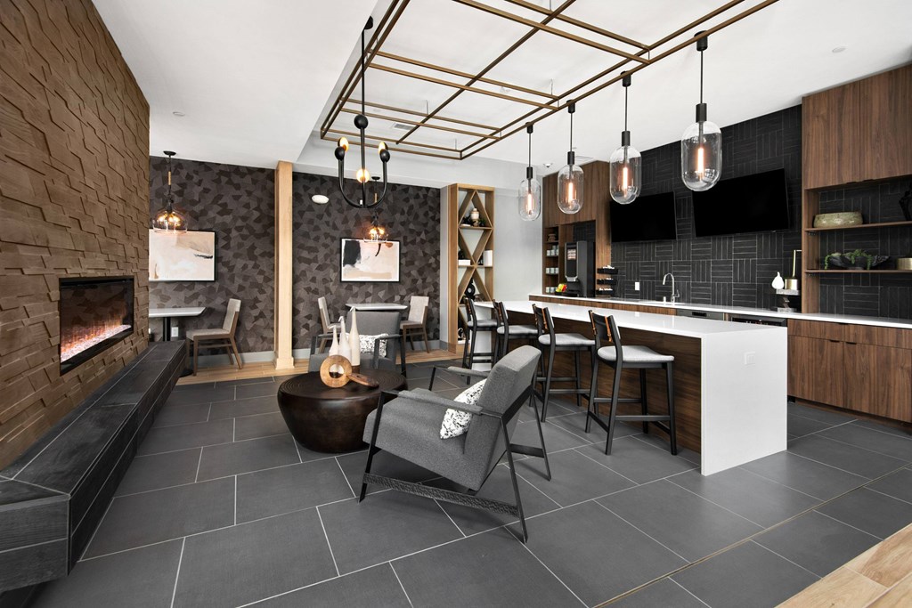 a living room with a fireplace and a table with chairs