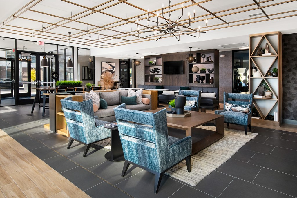 the lobby of a hotel with couches and chairs