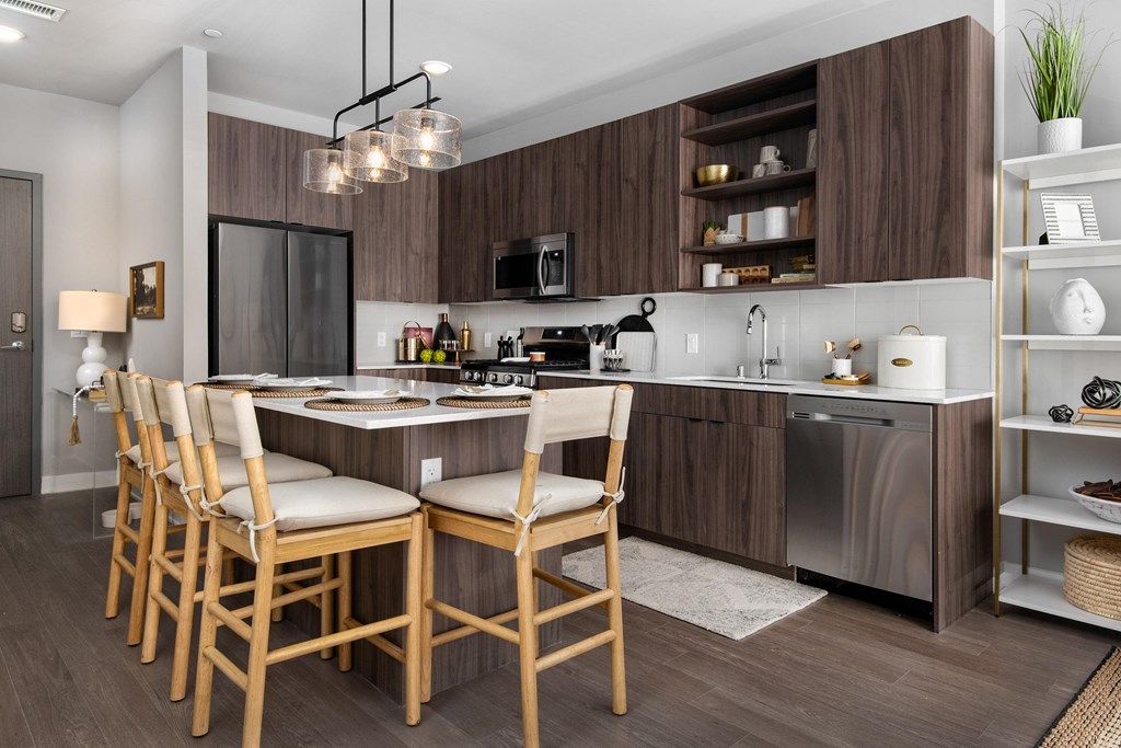 a kitchen with a large island and a dining table