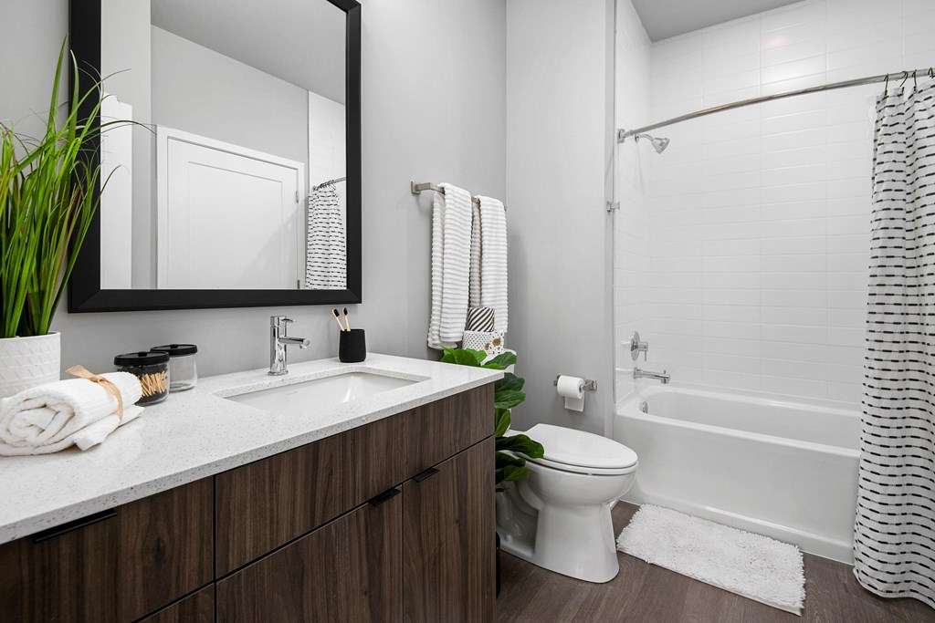 an image of a bathroom with a toilet sink and shower