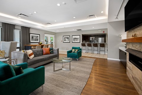 A living room with a green couch and a coffee table.