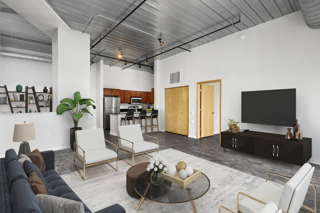 a living room with white walls and a wooden ceiling