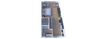 A top down view of a small apartment with a bed, a couch, a desk, and a kitchenette.