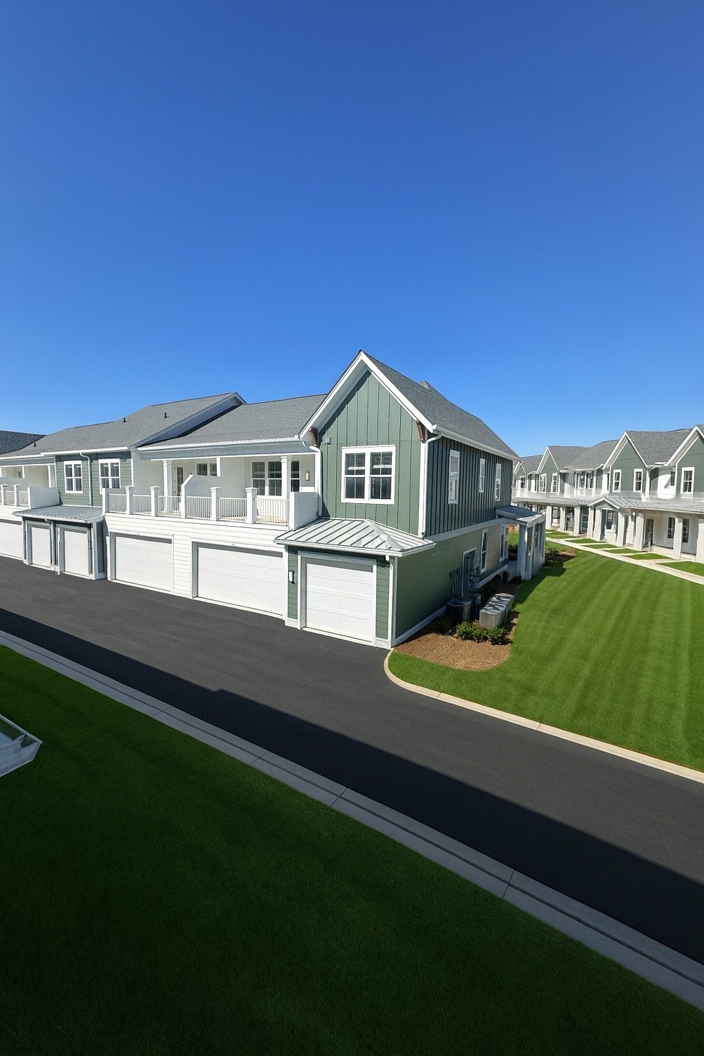 A row of houses with a clear blue sky above them.