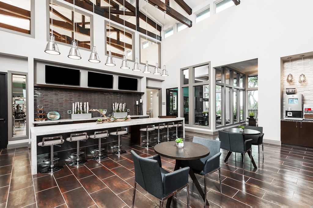 a restaurant with a bar and tables and chairs