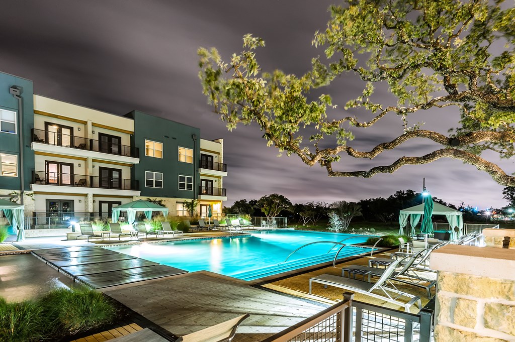 a swimming pool at night at the grove resort and spa