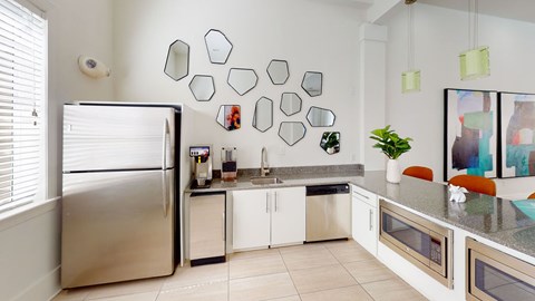 a kitchen with stainless steel appliances and a counter top