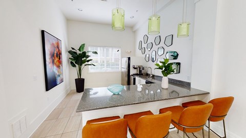 a dining room with a table and chairs