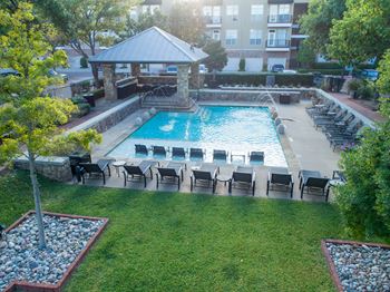 Resort style pool with lounge chairs