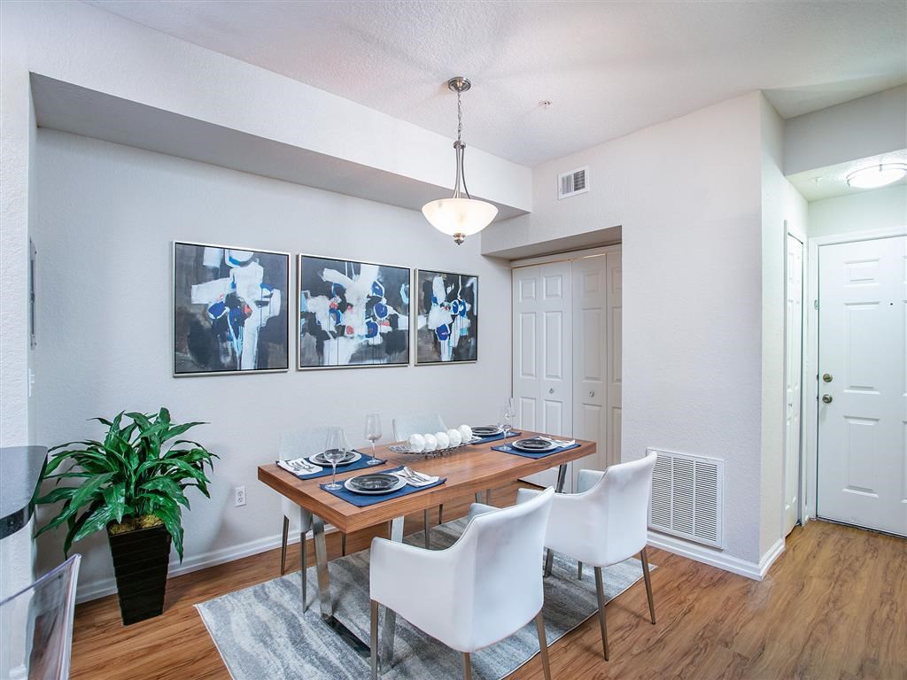a dining room with a table and chairs